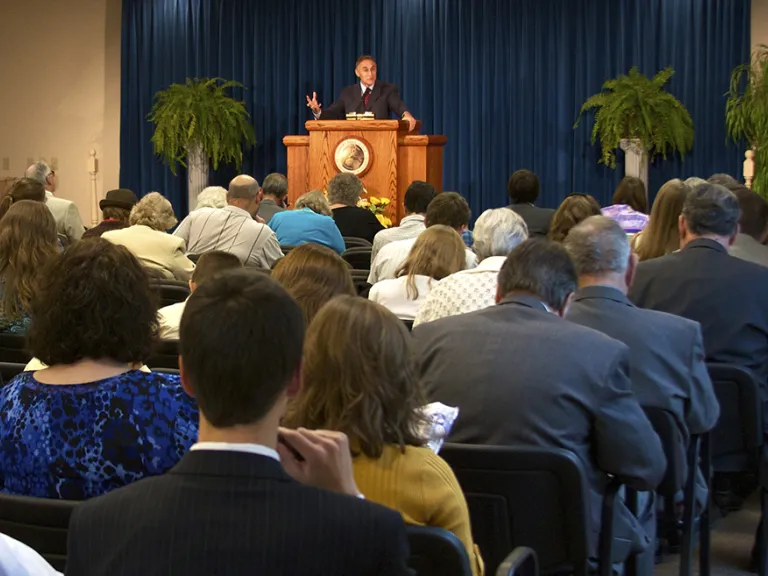 A church congregation listening to a sermon.