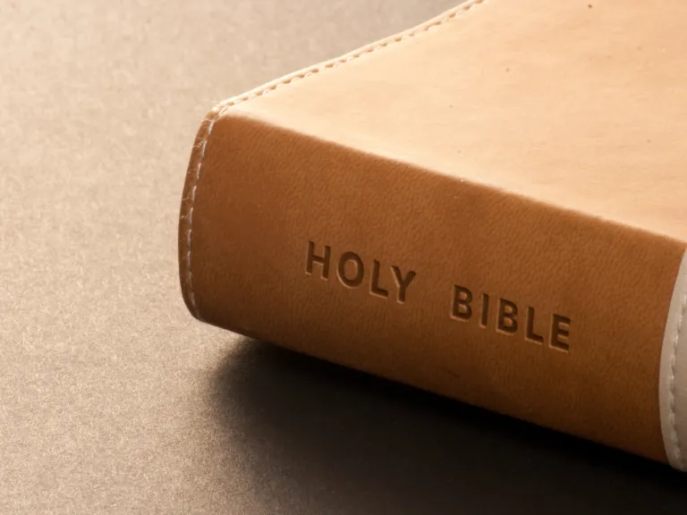 A Bible laying on a table.