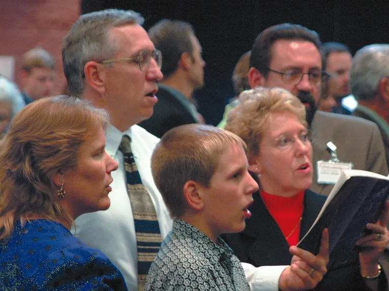 People singing during church service.