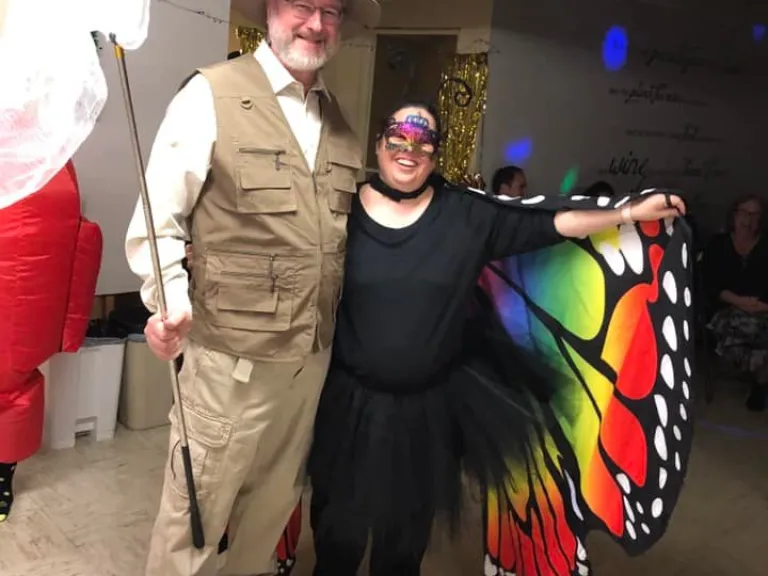 A couple dressed in butterfly-themed costumes