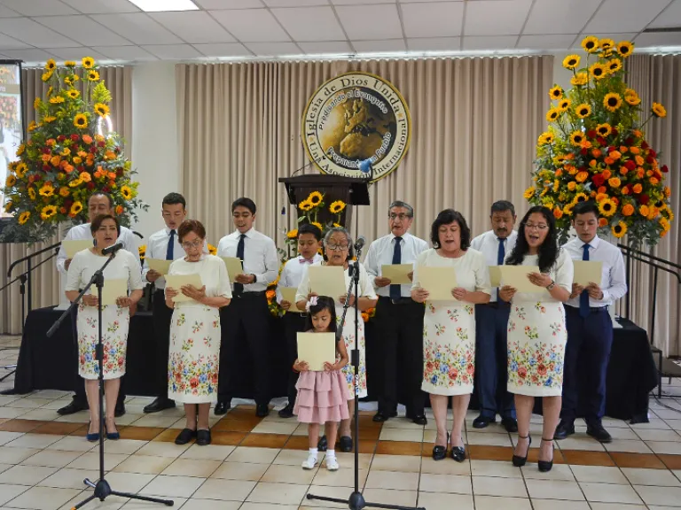 a choir singing while wearing coordinating clothes