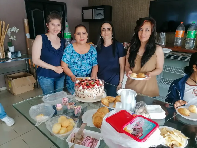a group of ladies preparing desserts