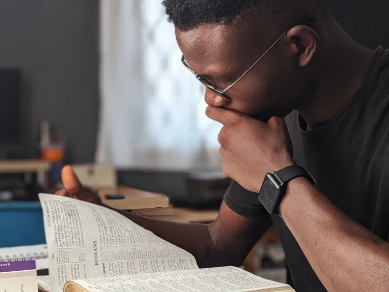 a man reading a Bible