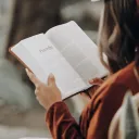 Girl looking at Bible